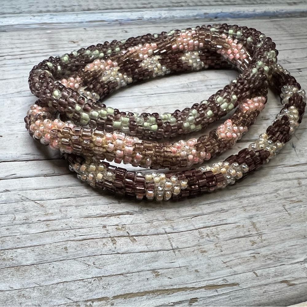 Aid through trade roll on bracelets!! Browns and soft pinks. Set of 3!